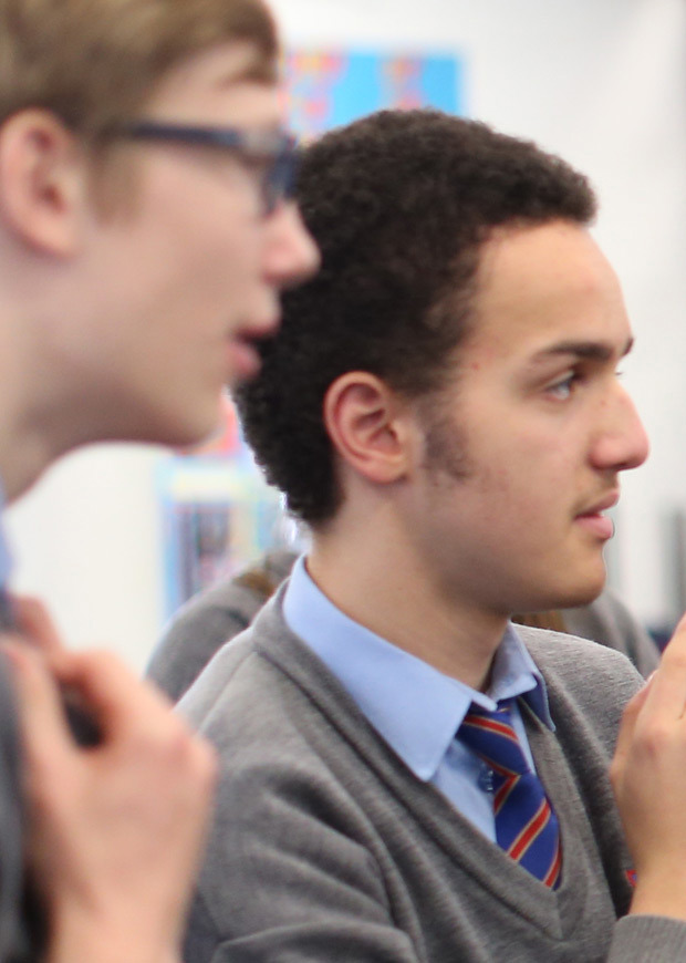 Two students listening and looking in the same direction