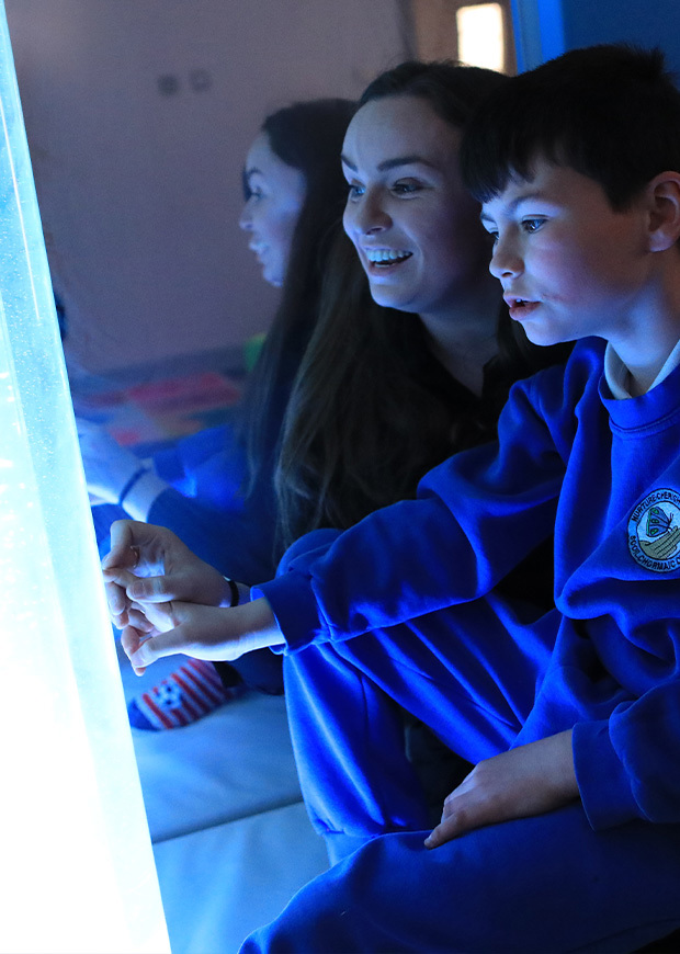 Teacher and child in sensory room. 